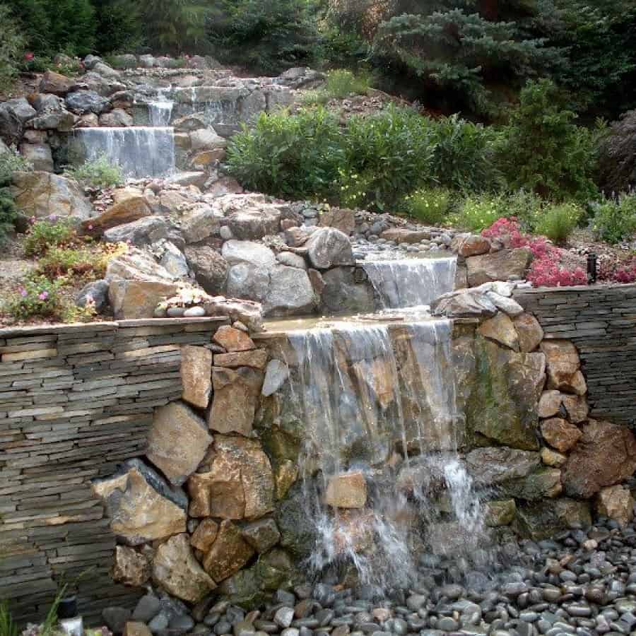 Natural Stacked Bluestone Retaining Wall with Moss Rock accents - Roslyn, Long Island NY