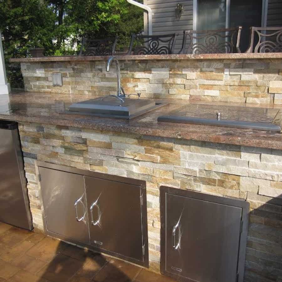Outdoor Kitchen with bar top veneered in East West Stone - Honey Gold - Granite Countertop - Flanders, Long Island NY