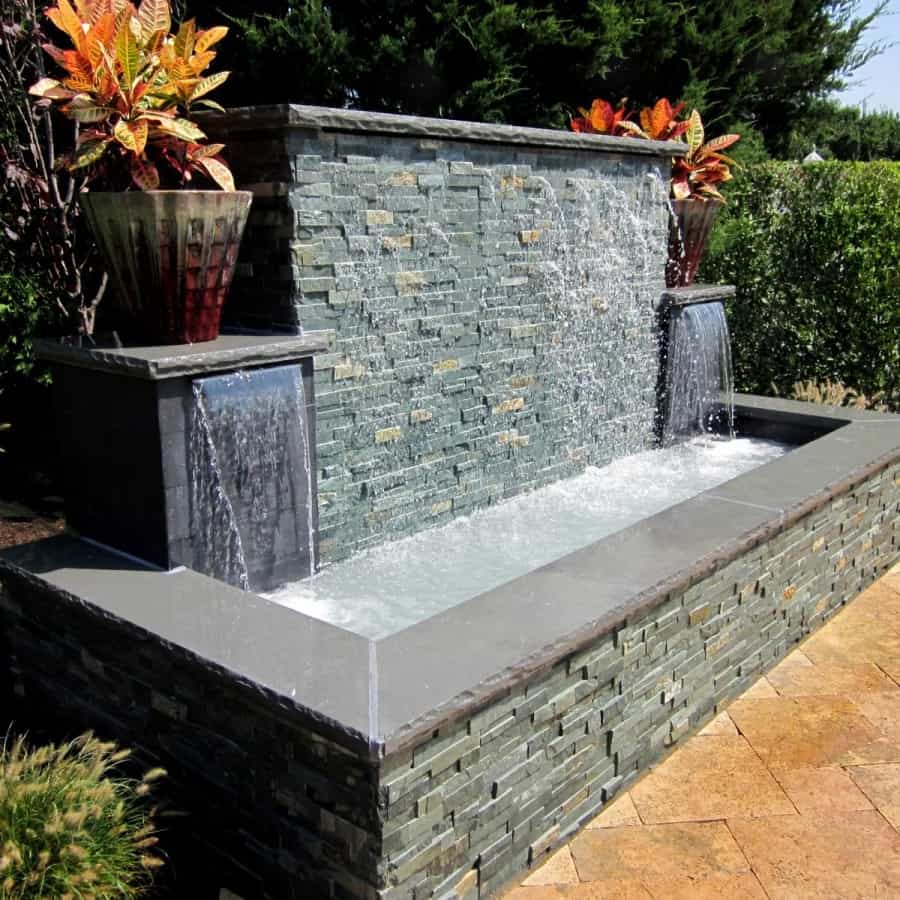 Gunite fountain with East West Stone Waterwall, Black Slate tile Sheer Descents, and rock faced bluestone caps - Southampton, Long Island NY