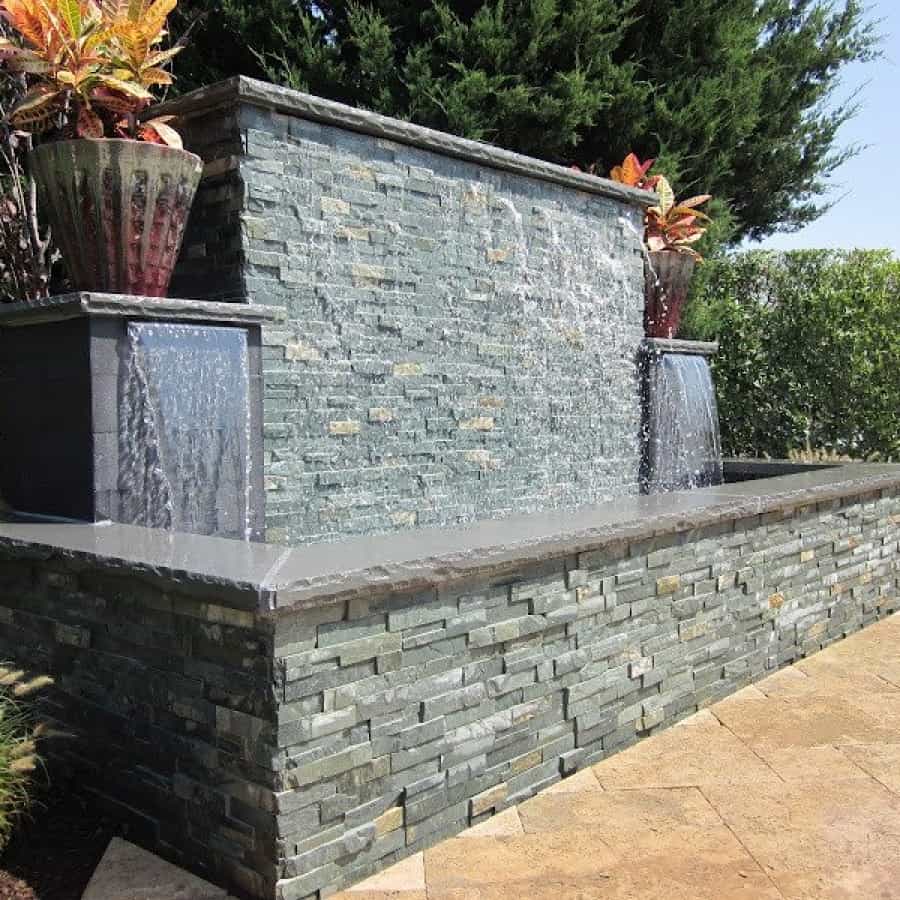 Gunite fountain with East West Stone Waterwall, Black Slate tile Sheer Descents, and rock faced bluestone caps - Southampton, Long Island NY