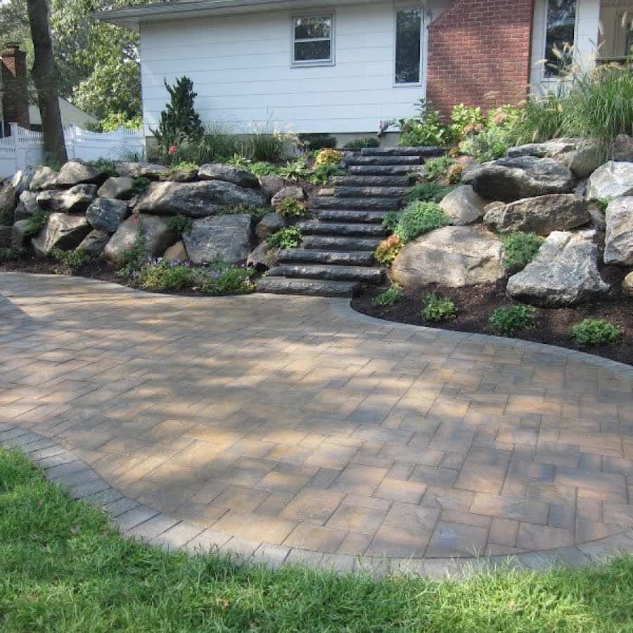 Cambridge Cast Stone Steps- Bluestone Blend set into staggered New York State Boulder retaining wall - Smithtown, Long Island NY