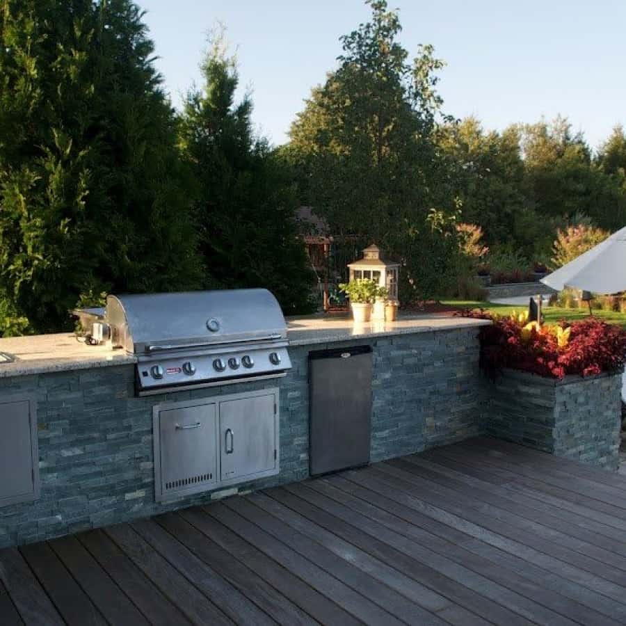 Outdoor Kitchen veneered with East West Stone - Bayside Waters - Eqipped with Bull Stainless Steel sink, Refrigerator, and 38 inch Brahma Grill - Southampton, Long Island NY